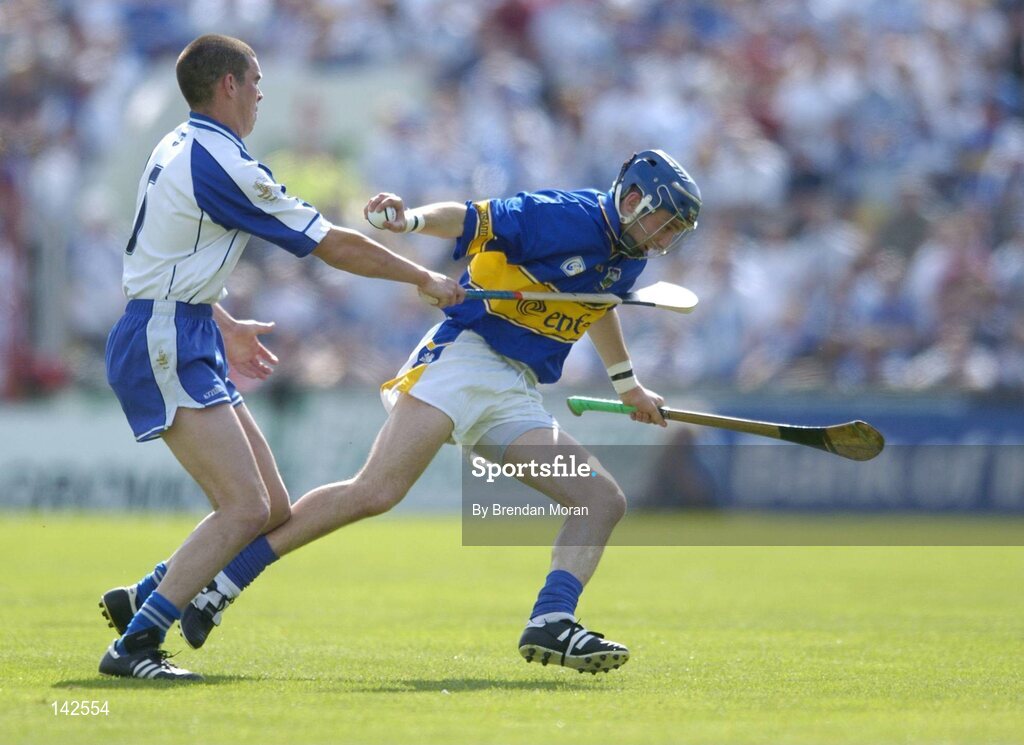 6 June 2004; Benny Dunne, Tipperary, in action against Brian Phelan, Waterford. Guinness Munster Senior Hurling Championship semi-final, Tipperary v Waterford, Pairc Ui Chaoimh, Cork. Picture credit; Brendan Moran / SPORTSFILE