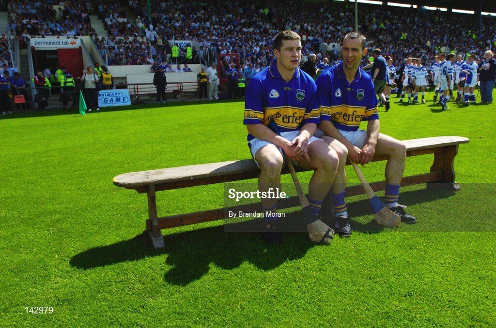 6 June 2004; Tipperary's John Carroll, left, and team captain Tommy Dunne sit on the bench before the team photograph. Guinness Munster Senior Hurling Championship semi-final, Tipperary v Waterford, Pairc Ui Chaoimh, Cork. Picture credit; Brendan Moran / SPORTSFILE