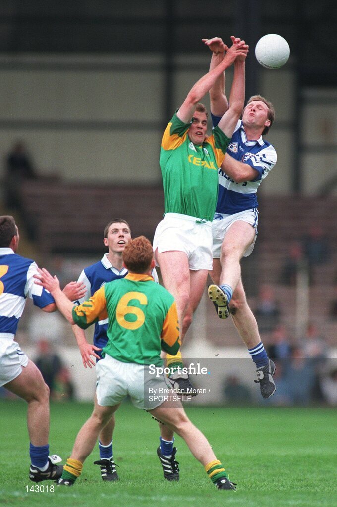 7 July 1997; John McDermott, Meath, contests a high ball with Tony Maher, Laois, as Tom Bowe (13) and Ian Fitzgerald, Laois and Enda McManus, Meath (6) await the dropping ball. Bank of Ireland Leinster Football Championship, Meath v Laois, Croke Park, Dublin. Picture credit; Brendan Moran / SPORTSFILE