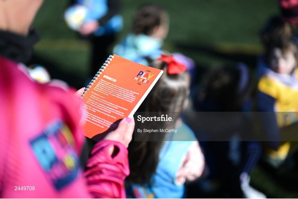7 March 2023; A coach reads the Playmakers book during the launch of UEFA Disney Playmakers 2023 at Hartstown Huntstown Football Club in Dublin. Photo by Stephen McCarthy/Sportsfile