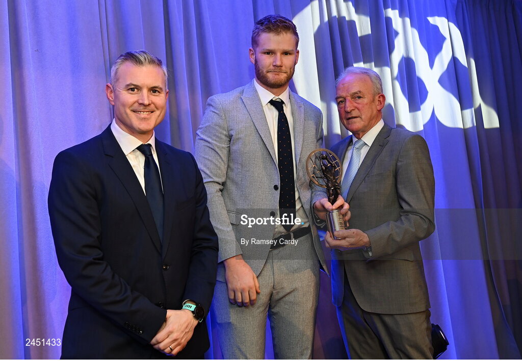 10 March 2023; Conor Ferris of Kilmacud Crokes is presented with his AIB GAA Football Club Team of The Year award by GAA Vice President John Murphy, right, and AIB CMO Mark Doyle, at the AIB Club Players Awards at Croke Park in Dublin. Photo by Ramsey Cardy/Sportsfile