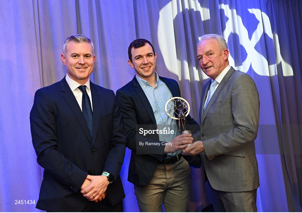 10 March 2023; Michael Warnock of Watty Graham’s Glen is presented with his AIB GAA Football Club Team of The Year award by GAA Vice President John Murphy, right, and AIB CMO Mark Doyle, at the AIB Club Players Awards at Croke Park in Dublin. Photo by Ramsey Cardy/Sportsfile