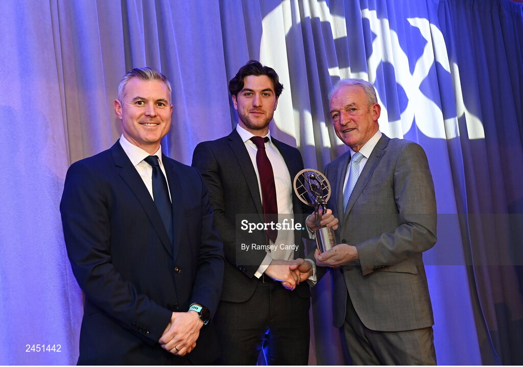 10 March 2023; Andrew McGowan of Kilmacud Crokes is presented with his AIB GAA Football Club Team of The Year award by GAA Vice President John Murphy, right, and AIB CMO Mark Doyle, at the AIB Club Players Awards at Croke Park in Dublin. Photo by Ramsey Cardy/Sportsfile
