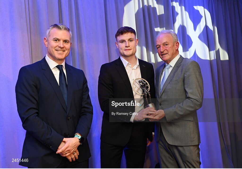 10 March 2023; Ethan Doherty of Watty Graham’s Glen is presented with his AIB GAA Football Club Team of The Year award by GAA Vice President John Murphy, right, and AIB CMO Mark Doyle, at the AIB Club Players Awards at Croke Park in Dublin. Photo by Ramsey Cardy/Sportsfile