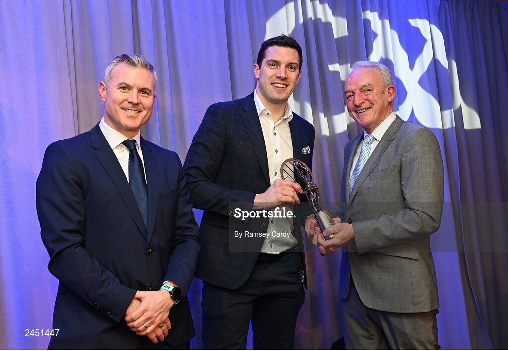 10 March 2023; David Moran of Kerins O’Rahilly’s is presented with his AIB GAA Football Club Team of The Year award by GAA Vice President John Murphy, right, and AIB CMO Mark Doyle, at the AIB Club Players Awards at Croke Park in Dublin. Photo by Ramsey Cardy/Sportsfile