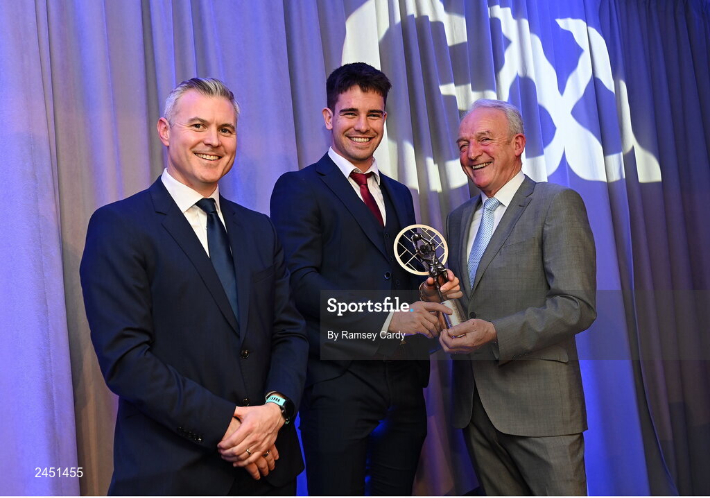 10 March 2023; Seán Kelly of Moycullen is presented with his AIB GAA Football Club Team of The Year award by GAA Vice President John Murphy, right, and AIB CMO Mark Doyle, at the AIB Club Players Awards at Croke Park in Dublin. Photo by Ramsey Cardy/Sportsfile