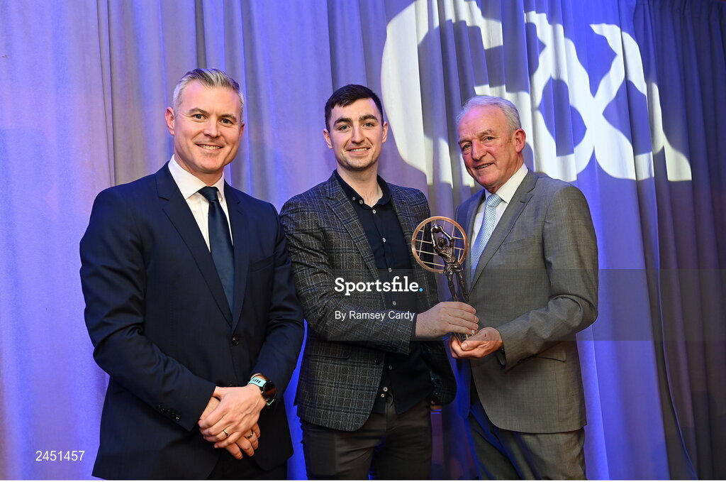 10 March 2023; Danny Tallon of Watty Graham’s Glen is presented with his AIB GAA Football Club Team of The Year award by GAA Vice President John Murphy, right, and AIB CMO Mark Doyle, at the AIB Club Players Awards at Croke Park in Dublin. Photo by Ramsey Cardy/Sportsfile
