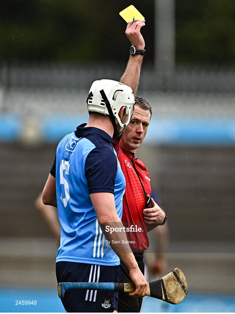 19 March 2023; Conor Donohoe of Dublin is shown a yellow card by referee Shane Hynes during the Allianz Hurling League Division 1 Group B match between Dublin and Laois at Parnell Park in Dublin. Photo by Sam Barnes/Sportsfile