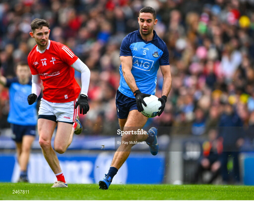 26 March 2023; James McCarthy of Dublin in action against Ciarán Downey of Louth during the Allianz Football League Division 2 match between Dublin and Louth at Croke Park in Dublin. Photo by Ray McManus/Sportsfile