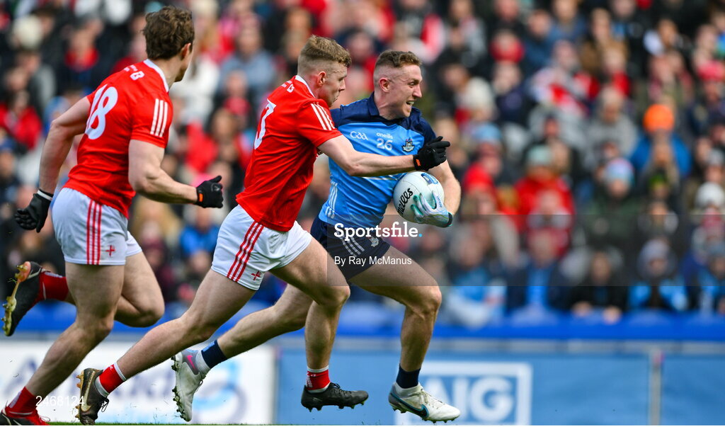 26 March 2023; Paddy Small of Dublin in action against Peter Lynch, 3, and Bevan Duffy of Louth during the Allianz Football League Division 2 match between Dublin and Louth at Croke Park in Dublin. Photo by Ray McManus/Sportsfile