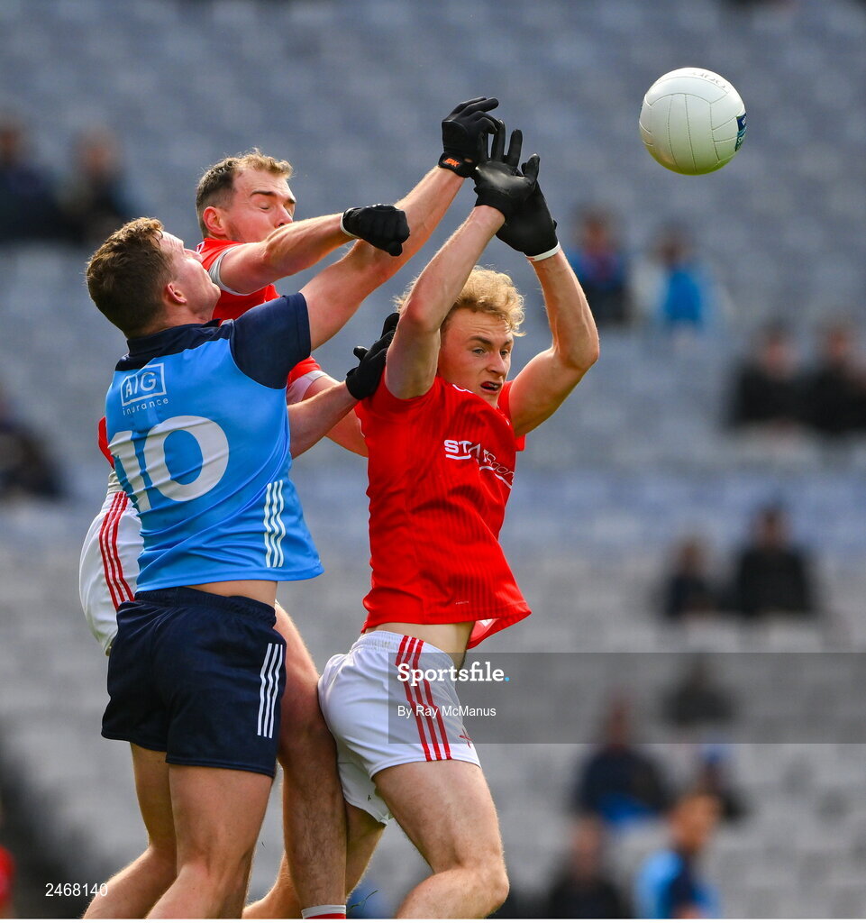26 March 2023; Ciarán Kilkenny of Dublin in action against Conor Early, left, and Leonard Grey of Louth during the Allianz Football League Division 2 match between Dublin and Louth at Croke Park in Dublin. Photo by Ray McManus/Sportsfile
