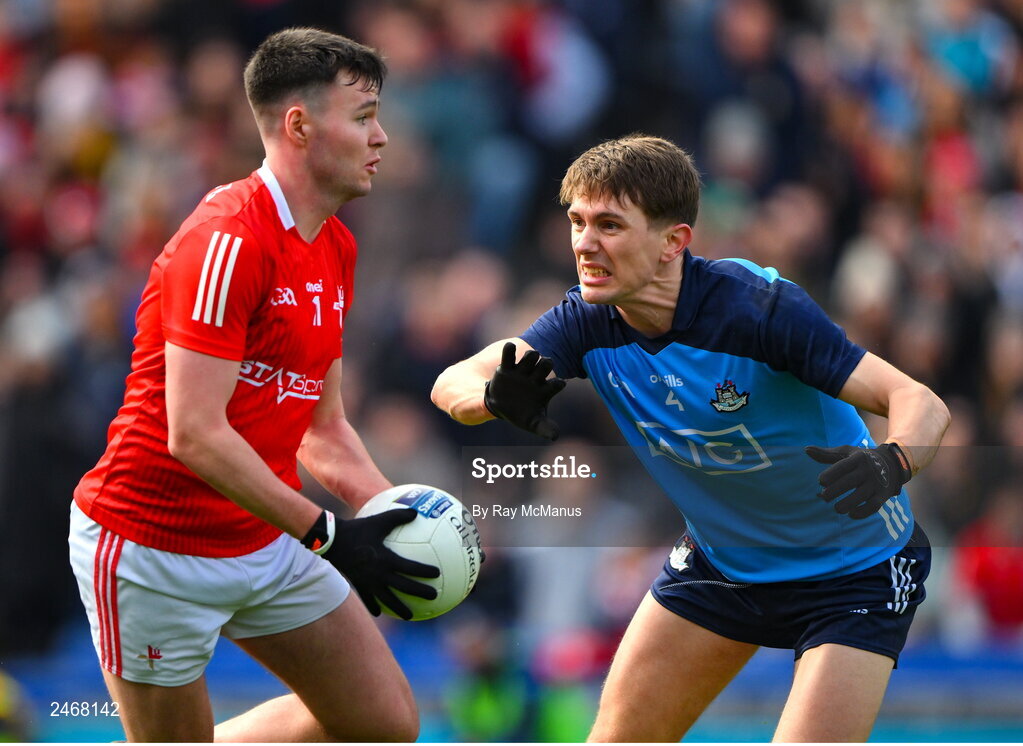 26 March 2023; Liam Jackson of Louth goes past Michael Fitzsimons of Dublin on his way to score his side's goal, in the 48th minute, during the Allianz Football League Division 2 match between Dublin and Louth at Croke Park in Dublin. Photo by Ray McManus/Sportsfile