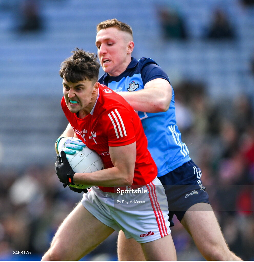 26 March 2023; Dáire McConnon of Louth is tackled by Paddy Small of Dublin during the Allianz Football League Division 2 match between Dublin and Louth at Croke Park in Dublin. Photo by Ray McManus/Sportsfile