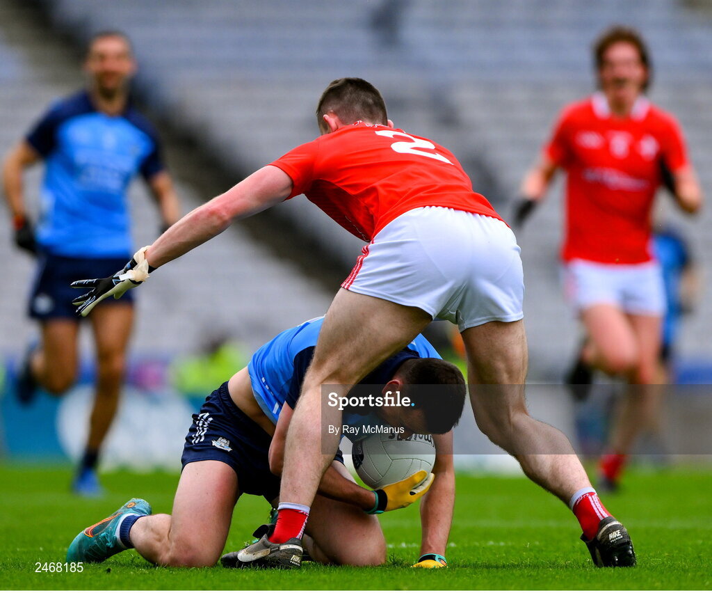 26 March 2023; Cormac Costello of Dublin is tackled by Dan Corcoran of Louth during the Allianz Football League Division 2 match between Dublin and Louth at Croke Park in Dublin. Photo by Ray McManus/Sportsfile