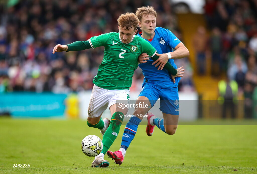 26 March 2023; Sam Curtis of Republic of Ireland in action against Isak Andri Sigurgeirsson of Iceland during the Under-21 international friendly match between Republic of Ireland and Iceland at Turner's Cross in Cork. Photo by Michael P Ryan/Sportsfile
