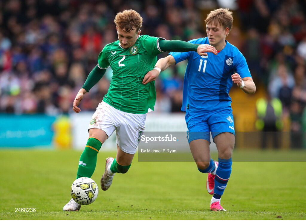 26 March 2023; Sam Curtis of Republic of Ireland in action against Isak Andri Sigurgeirsson of Iceland during the Under-21 international friendly match between Republic of Ireland and Iceland at Turner's Cross in Cork. Photo by Michael P Ryan/Sportsfile