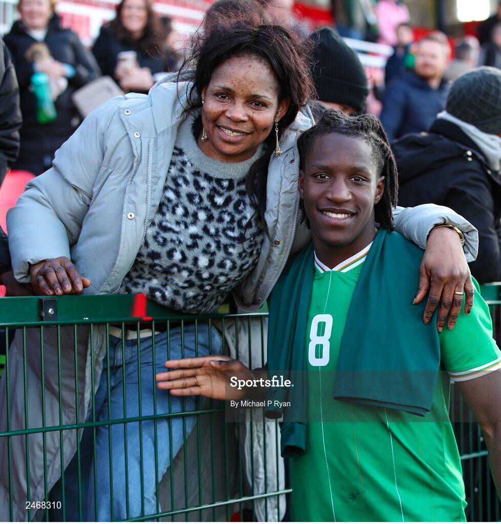 26 March 2023; Bosun Lawal of Republic of Ireland with his mother Banke after the Under-21 international friendly match between Republic of Ireland and Iceland at Turner's Cross in Cork. Photo by Michael P Ryan/Sportsfile