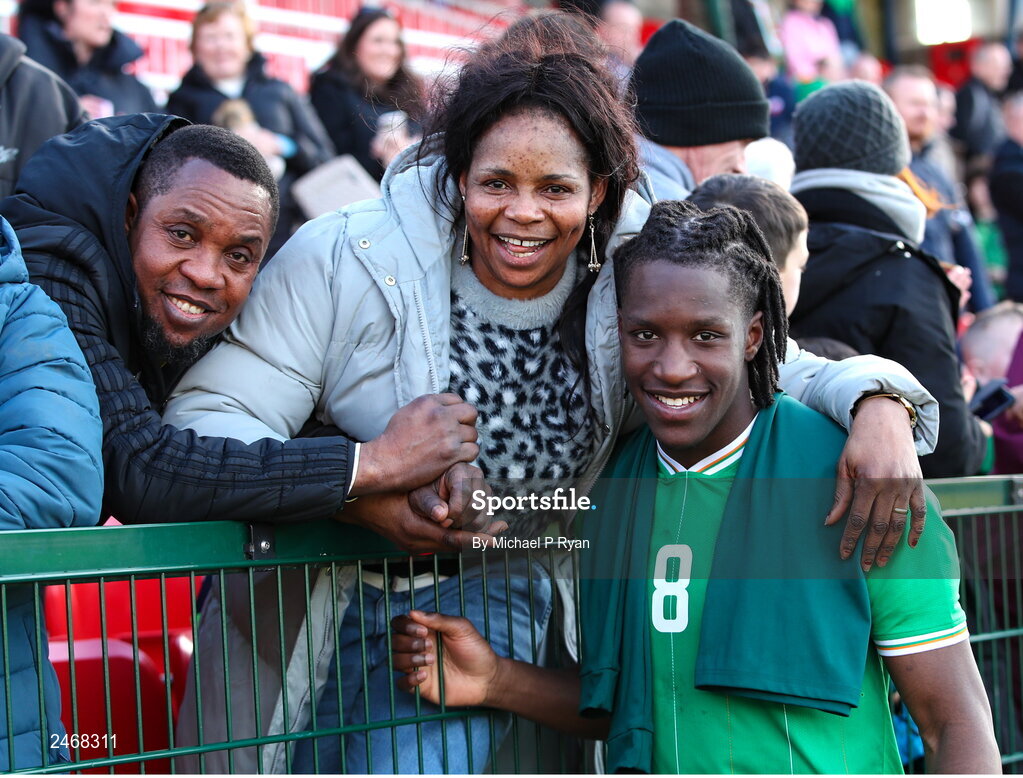 26 March 2023; Bosun Lawal of Republic of Ireland with his parents Banke and Olalekan after the Under-21 international friendly match between Republic of Ireland and Iceland at Turner's Cross in Cork. Photo by Michael P Ryan/Sportsfile