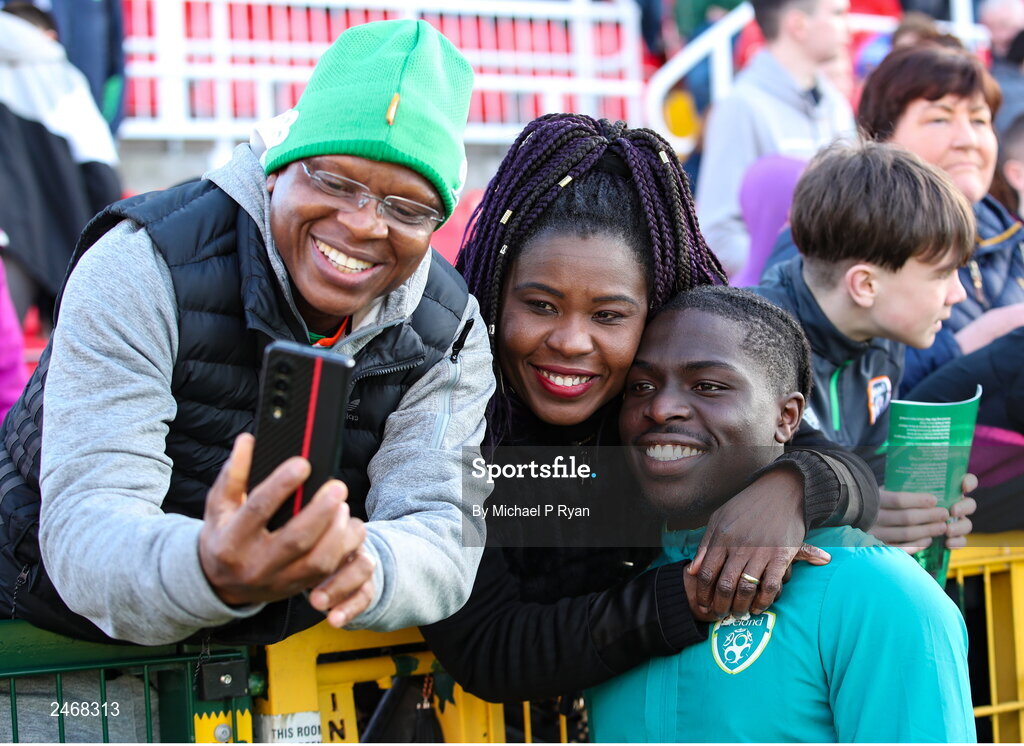 26 March 2023; Festy Ebosele of Republic of Ireland with parents Festus and Lydia after the Under-21 international friendly match between Republic of Ireland and Iceland at Turner's Cross in Cork. Photo by Michael P Ryan/Sportsfile