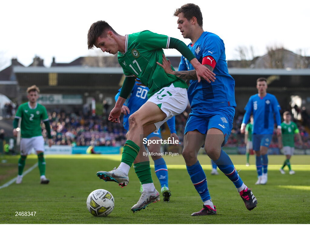 26 March 2023; Johnny Kenny of Republic of Ireland in action against Oliver Stefansson of Iceland during the Under-21 international friendly match between Republic of Ireland and Iceland at Turner's Cross in Cork. Photo by Michael P Ryan/Sportsfile