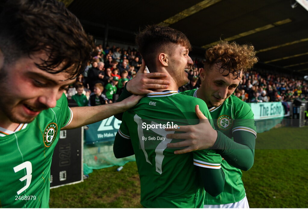 26 March 2023; Johnny Kenny of Republic of Ireland, centre, celebrates with teammates Sam Curtis, right, and Sean Roughan after scoring their side's second goal during the Under-21 international friendly match between Republic of Ireland and Iceland at Turners Cross in Cork. Photo by Seb Daly/Sportsfile