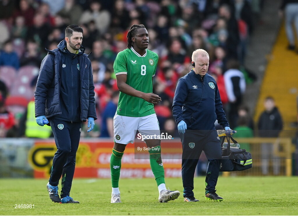26 March 2023; Republic of Ireland team doctor Dr Mortimer O'Connor, right, and physiotherapist Glauber Barduzzi with Bosun Lawal during the Under-21 international friendly match between Republic of Ireland and Iceland at Turners Cross in Cork. Photo by Seb Daly/Sportsfile