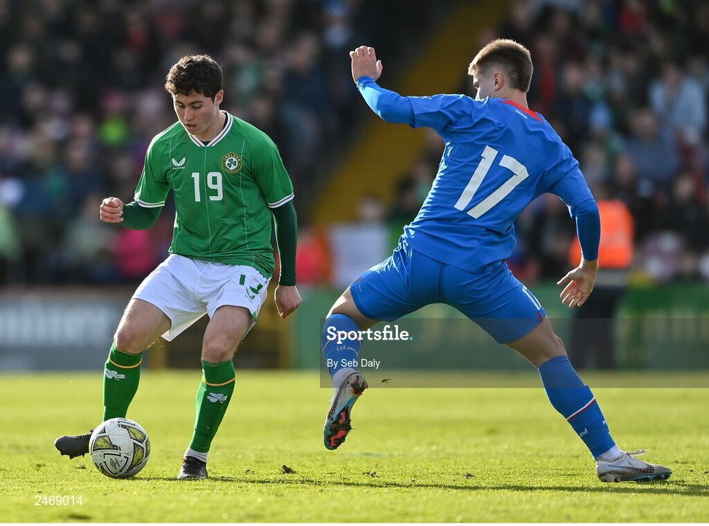 26 March 2023; Kian Leavy of Republic of Ireland in action against Lukas Logi Heimisson of Iceland during the Under-21 international friendly match between Republic of Ireland and Iceland at Turners Cross in Cork. Photo by Seb Daly/Sportsfile