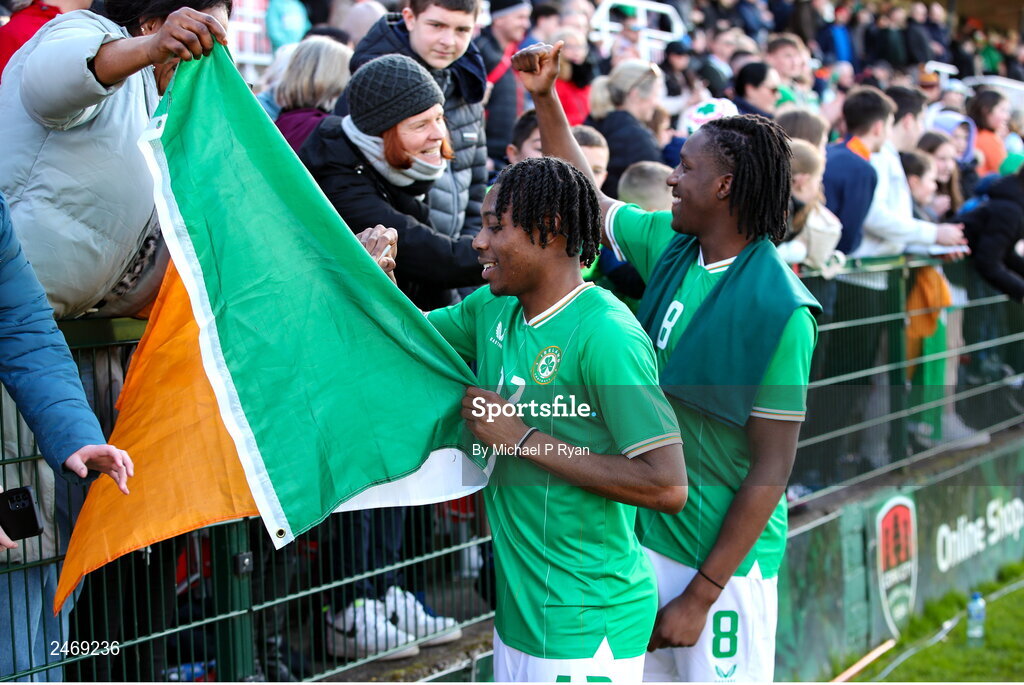 26 March 2023; Republic of Ireland players Tayo Adaramola, left, and Bosun Lawal with supporters after the Under-21 international friendly match between Republic of Ireland and Iceland at Turner's Cross in Cork. Photo by Michael P Ryan/Sportsfile