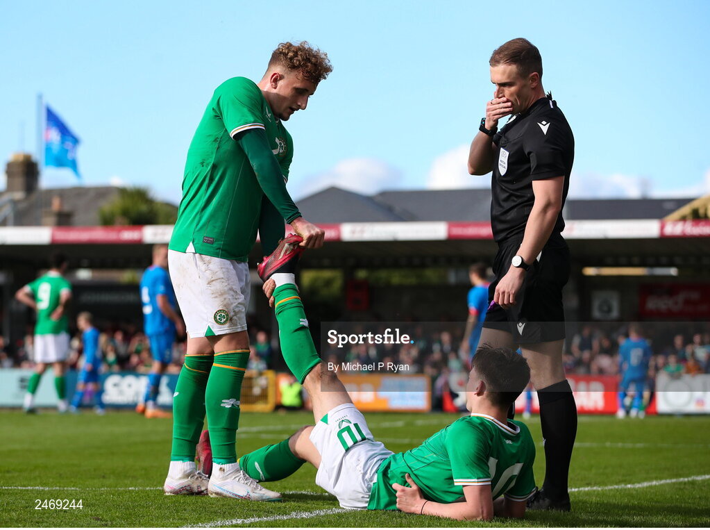 26 March 2023; Andrew Moran of Republic of Ireland receives assistance from teammate Sam Curtis during the Under-21 international friendly match between Republic of Ireland and Iceland at Turner's Cross in Cork. Photo by Michael P Ryan/Sportsfile
