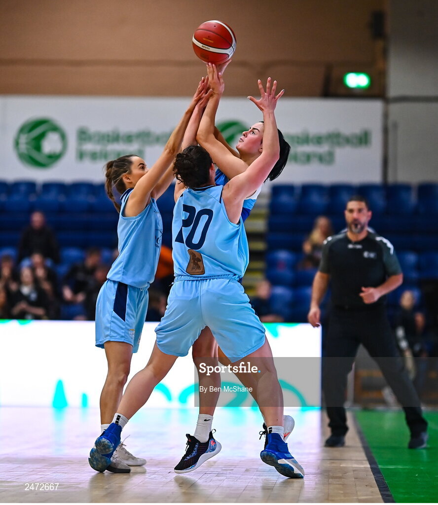 1 April 2023; Mia Furlong of The Address UCC Glanmire in action against Megan Connolly, left, and Amelia Motz of DCU Mercy during the MissQuote.ie Champions Trophy Final match between The Address UCC Glanmire, Cork and DCU Mercy, Dublin at National Basketball Arena in Tallaght, Dublin. Photo by Ben McShane/Sportsfile
