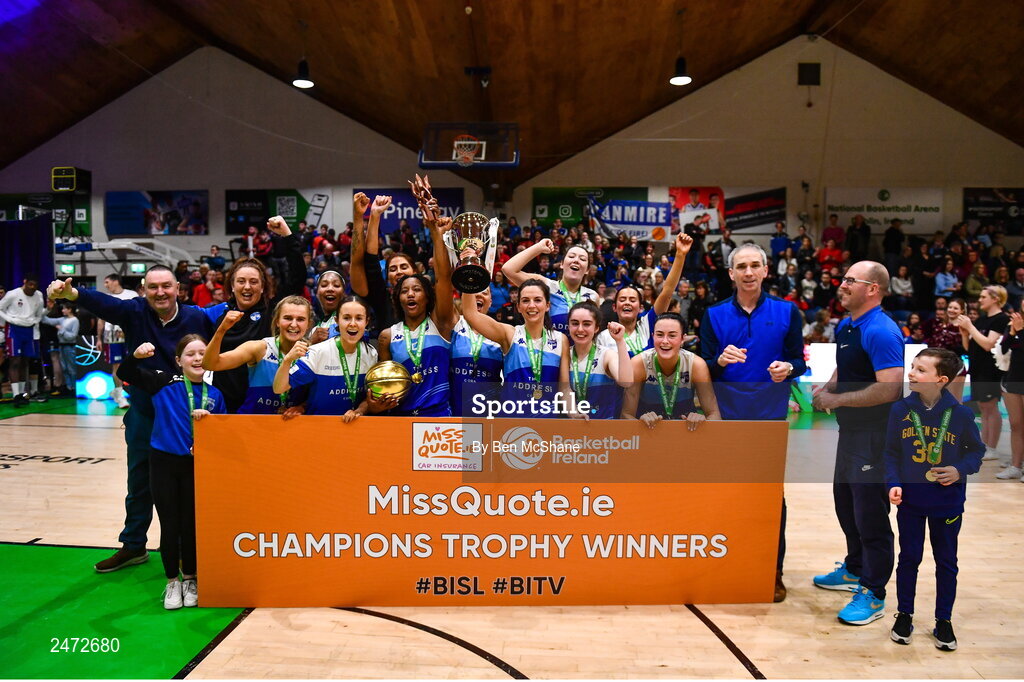 1 April 2023; The Address UCC Glanmire players celebrate with the cup after MissQuote.ie Champions Trophy Final match between The Address UCC Glanmire, Cork and DCU Mercy, Dublin at National Basketball Arena in Tallaght, Dublin. Photo by Ben McShane/Sportsfile