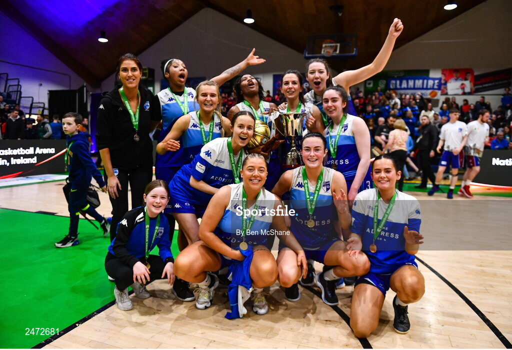 1 April 2023; The Address UCC Glanmire players celebrate with the cup after MissQuote.ie Champions Trophy Final match between The Address UCC Glanmire, Cork and DCU Mercy, Dublin at National Basketball Arena in Tallaght, Dublin. Photo by Ben McShane/Sportsfile