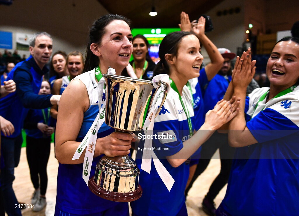 1 April 2023; The Address UCC Glanmire captain Áine McKenna leads the celebrations with her team and the cup after MissQuote.ie Champions Trophy Final match between The Address UCC Glanmire, Cork and DCU Mercy, Dublin at National Basketball Arena in Tallaght, Dublin. Photo by Ben McShane/Sportsfile