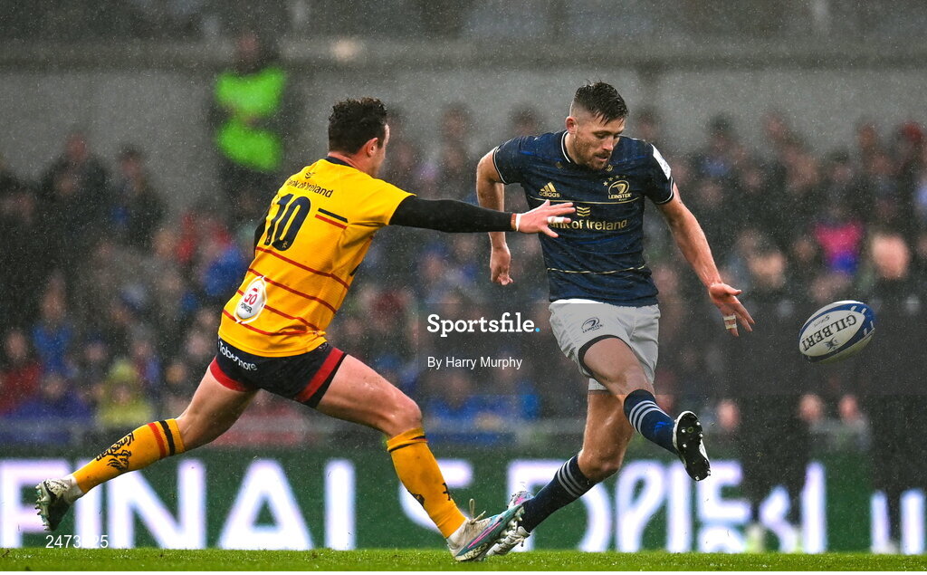 1 April 2023; Ross Byrne of Leinster kicks under pressure from Billy Burns of Ulster during the Heineken Champions Cup Round of 16 match between Leinster and Ulster at the Aviva Stadium in Dublin. Photo by Harry Murphy/Sportsfile