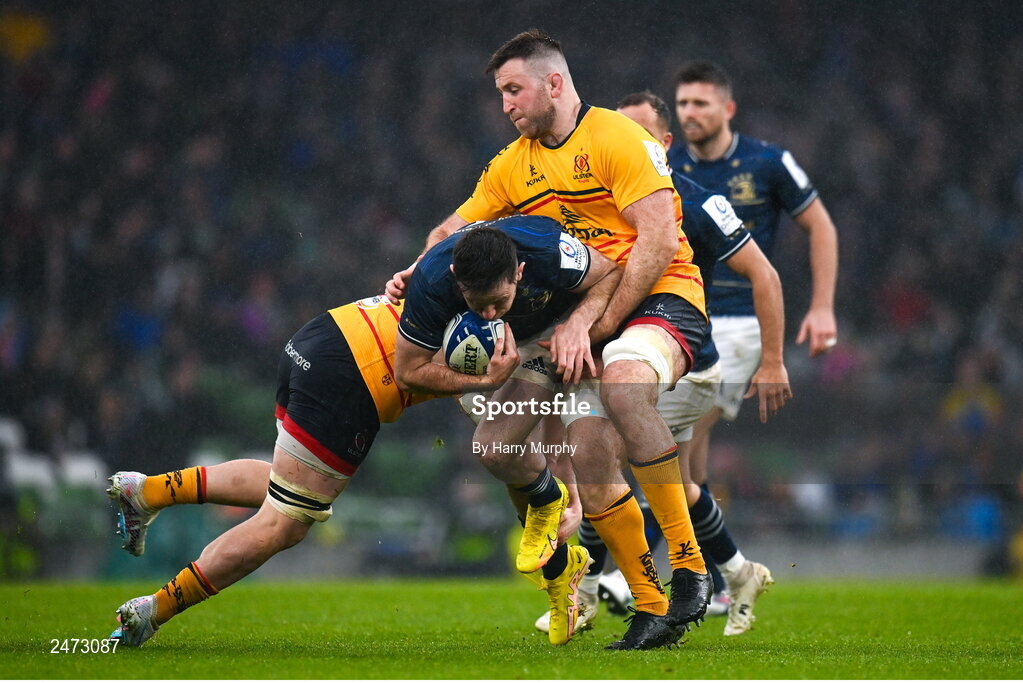 1 April 2023; Hugo Keenan of Leinster is tackled by Nick Timoney, left, and Alan O'Connor of Ulster during the Heineken Champions Cup Round of 16 match between Leinster and Ulster at the Aviva Stadium in Dublin. Photo by Harry Murphy/Sportsfile