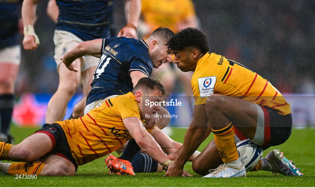 1 April 2023; Michael Lowry, left, and Robert Baloucoune of Ulster contest possession with Jordan Larmour of Leinster during the Heineken Champions Cup Round of 16 match between Leinster and Ulster at the Aviva Stadium in Dublin. Photo by Harry Murphy/Sportsfile