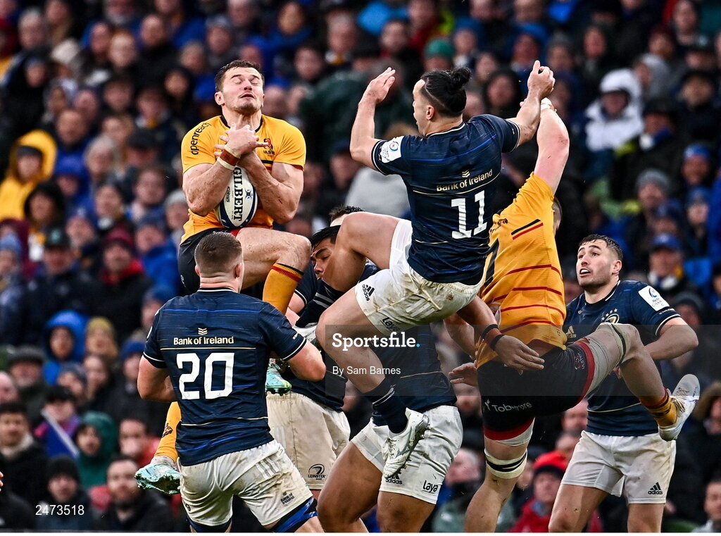 1 April 2023; Jacob Stockdale of Ulster and James Lowe of Leinster contest a high ball during the Heineken Champions Cup Round of 16 match between Leinster and Ulster at Aviva Stadium in Dublin. Photo by Sam Barnes/Sportsfile