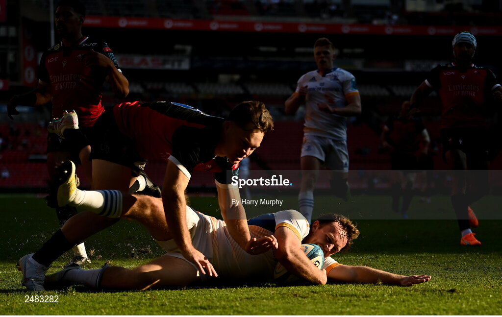 15 April 2023; Liam Turner of Leinster dives over to score his side's second try despite the tackle of Quan Horn of Emirates Lionsduring the United Rugby Championship match between Emirates Lions and Leinster at Emirates Airlines Park in Johannesburg, South Africa. Photo by Harry Murphy/Sportsfile