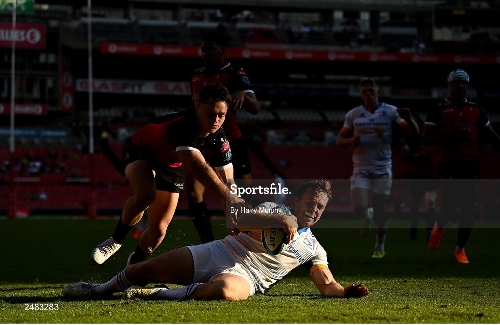 15 April 2023; Liam Turner of Leinster dives over to score his side's second try despite the tackle of Quan Horn of Emirates Lionsduring the United Rugby Championship match between Emirates Lions and Leinster at Emirates Airlines Park in Johannesburg, South Africa. Photo by Harry Murphy/Sportsfile