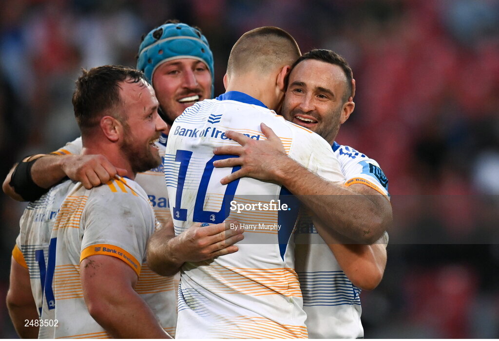 15 April 2023; Sam Prendergast of Leinster is embraced by teammates Ed Byrne, Will Connors and Dave Kearney after kicking a penalty to win the United Rugby Championship match between Emirates Lions and Leinster at Emirates Airlines Park in Johannesburg, South Africa. Photo by Harry Murphy/Sportsfile