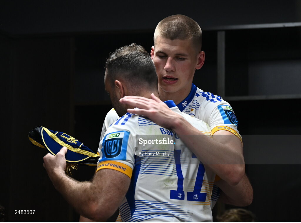15 April 2023; Sam Prendergast of Leinster is presented his first cap by teammate Dave Kearney after their side's victory in the United Rugby Championship match between Emirates Lions and Leinster at Emirates Airlines Park in Johannesburg, South Africa. Photo by Harry Murphy/Sportsfile