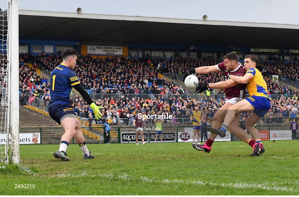23 April 2023; Damien Comer of Galway scores his side's first goal, despite the tackle of Roscommon's David Murray, during the Connacht GAA Football Senior Championship Semi-Final match between Roscommon and Galway at Dr Hyde Park in Roscommon. Photo by Seb Daly/Sportsfile