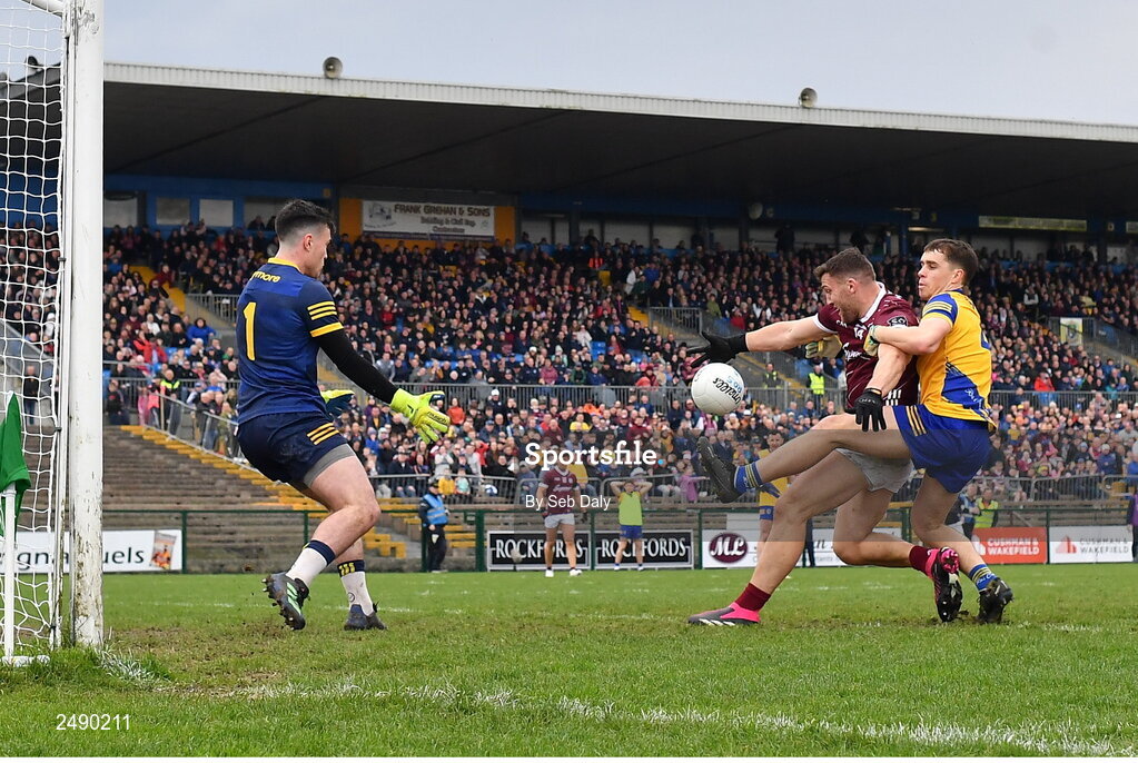 23 April 2023; Damien Comer of Galway scores his side's first goal, despite the tackle of Roscommon's David Murray, during the Connacht GAA Football Senior Championship Semi-Final match between Roscommon and Galway at Dr Hyde Park in Roscommon. Photo by Seb Daly/Sportsfile