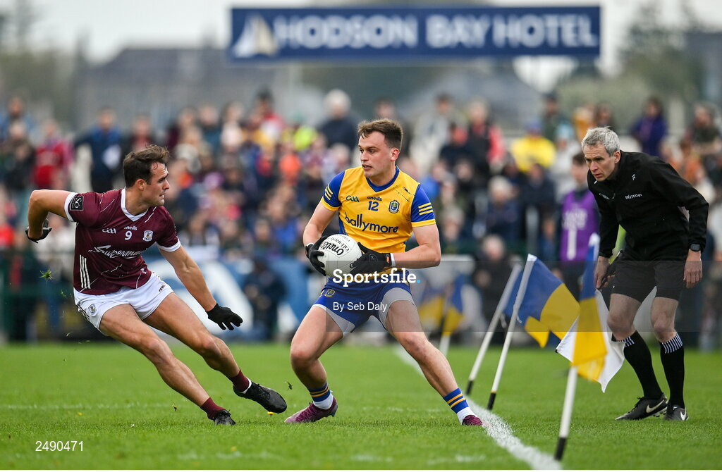 23 April 2023; Enda Smith of Roscommon in action against John Maher of Galway, watched by assistant referee Fergal Kelly, during the Connacht GAA Football Senior Championship Semi-Final match between Roscommon and Galway at Dr Hyde Park in Roscommon. Photo by Seb Daly/Sportsfile