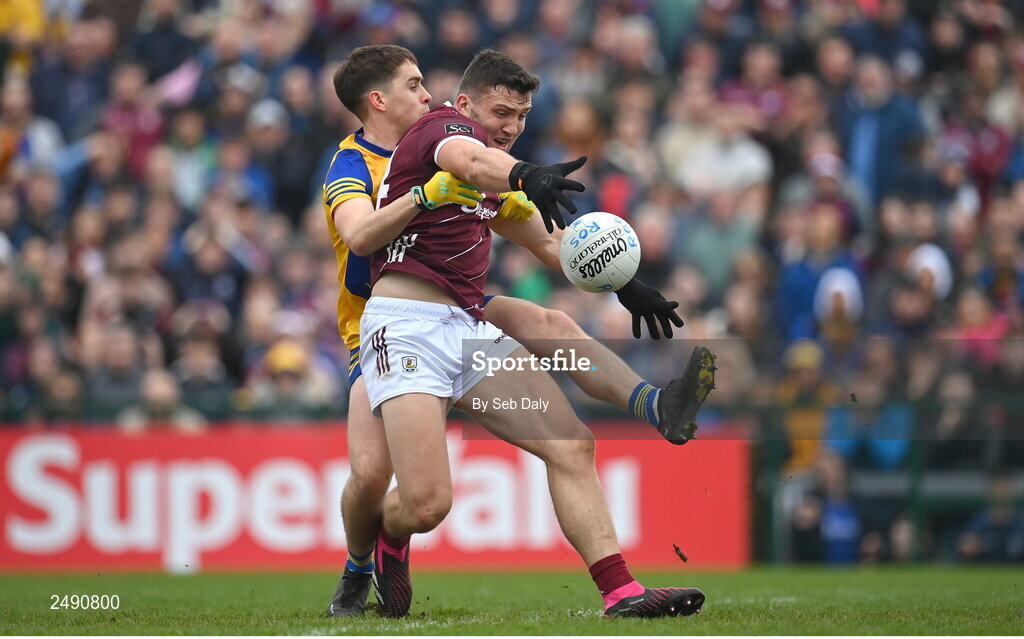 23 April 2023; Damien Comer of Galway scores his side's first goal, despite the tackle of Roscommon's David Murray, during the Connacht GAA Football Senior Championship Semi-Final match between Roscommon and Galway at Dr Hyde Park in Roscommon. Photo by Seb Daly/Sportsfile