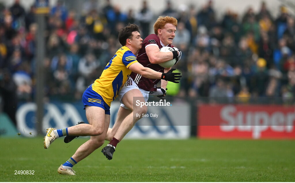 23 April 2023; Peter Cooke of Galway in action against Ben O’Carroll of Roscommon during the Connacht GAA Football Senior Championship Semi-Final match between Roscommon and Galway at Dr Hyde Park in Roscommon. Photo by Seb Daly/Sportsfile
