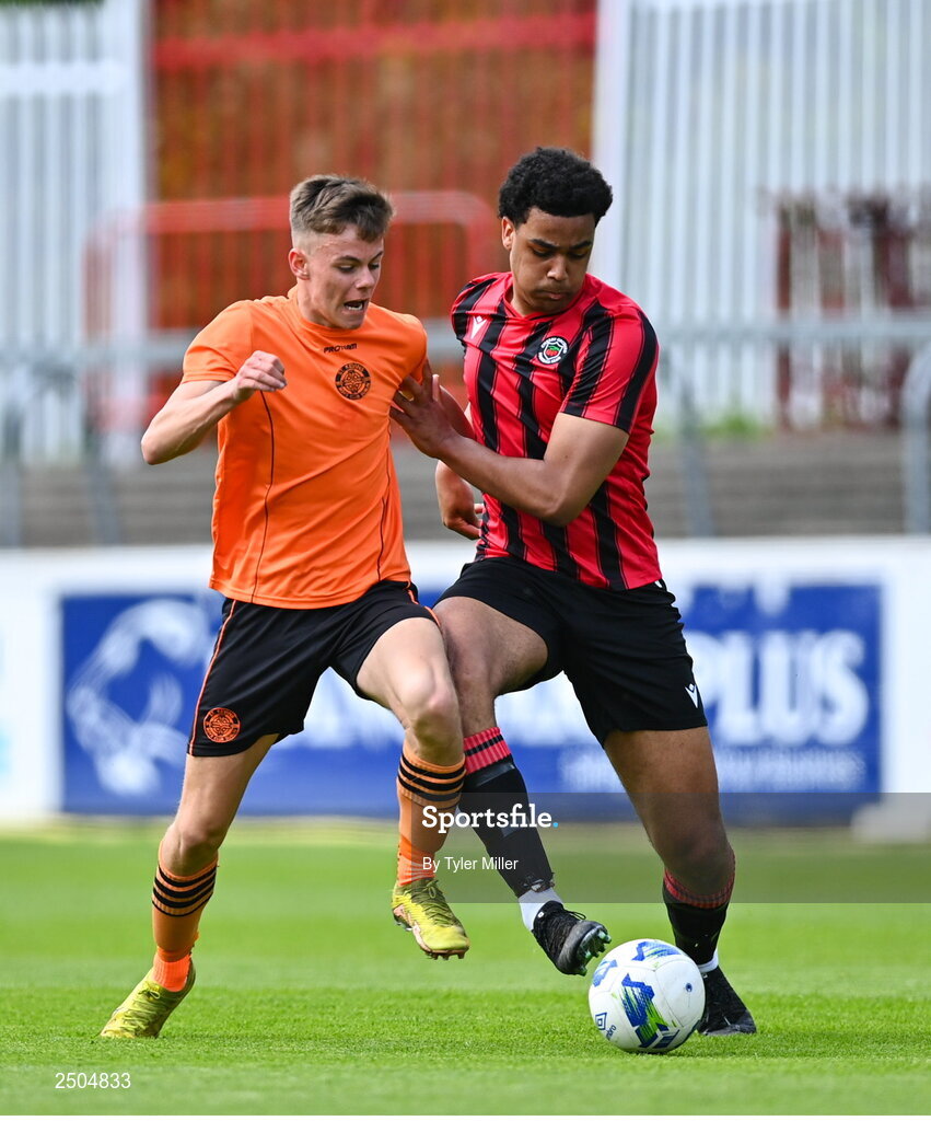 6 May 2023; Jamie Cummins of St Kevin's FC in action against Josh Okagbue of Cherry Orchard FC during the FAI Under 17 Cup Final 2022/23 match between Cherry Orchard FC and St Kevin’s Boys FC at Richmond Park in Dublin. Photo by Tyler Miller/Sportsfile