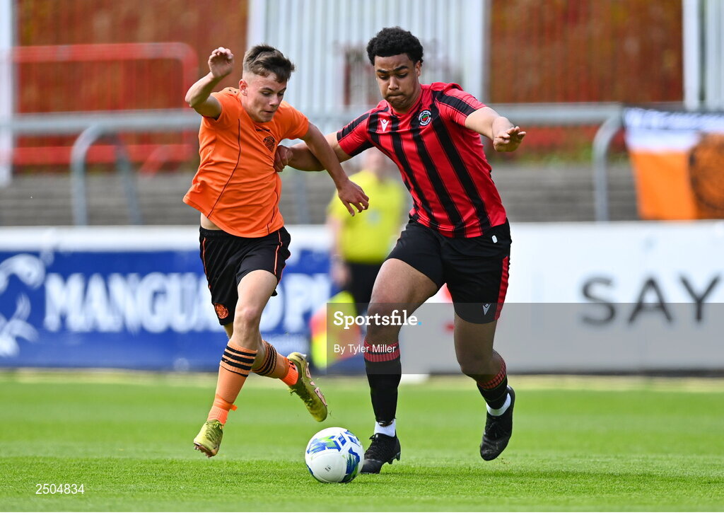 6 May 2023; Jamie Cummins of St Kevin's FC in action against Josh Okagbue of Cherry Orchard FC during the FAI Under 17 Cup Final 2022/23 match between Cherry Orchard FC and St Kevin’s Boys FC at Richmond Park in Dublin. Photo by Tyler Miller/Sportsfile