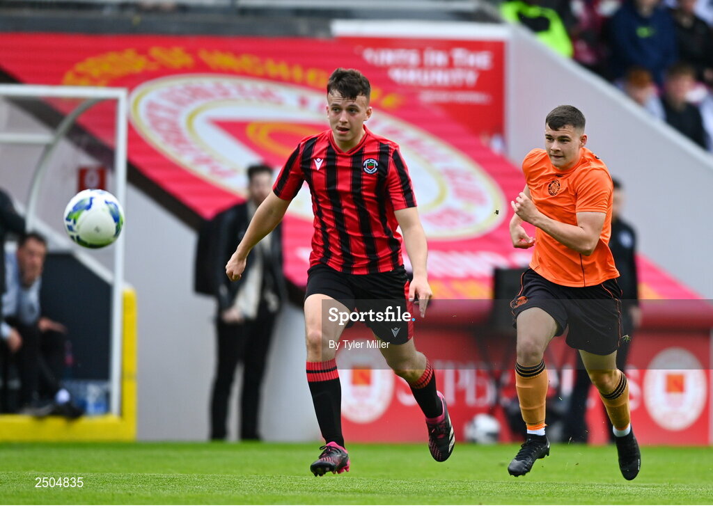 6 May 2023; Jack Cronin of Cherry Orchard FC in action against Karl Hearns of St Kevin's FC during the FAI Under 17 Cup Final 2022/23 match between Cherry Orchard FC and St Kevin’s Boys FC at Richmond Park in Dublin. Photo by Tyler Miller/Sportsfile