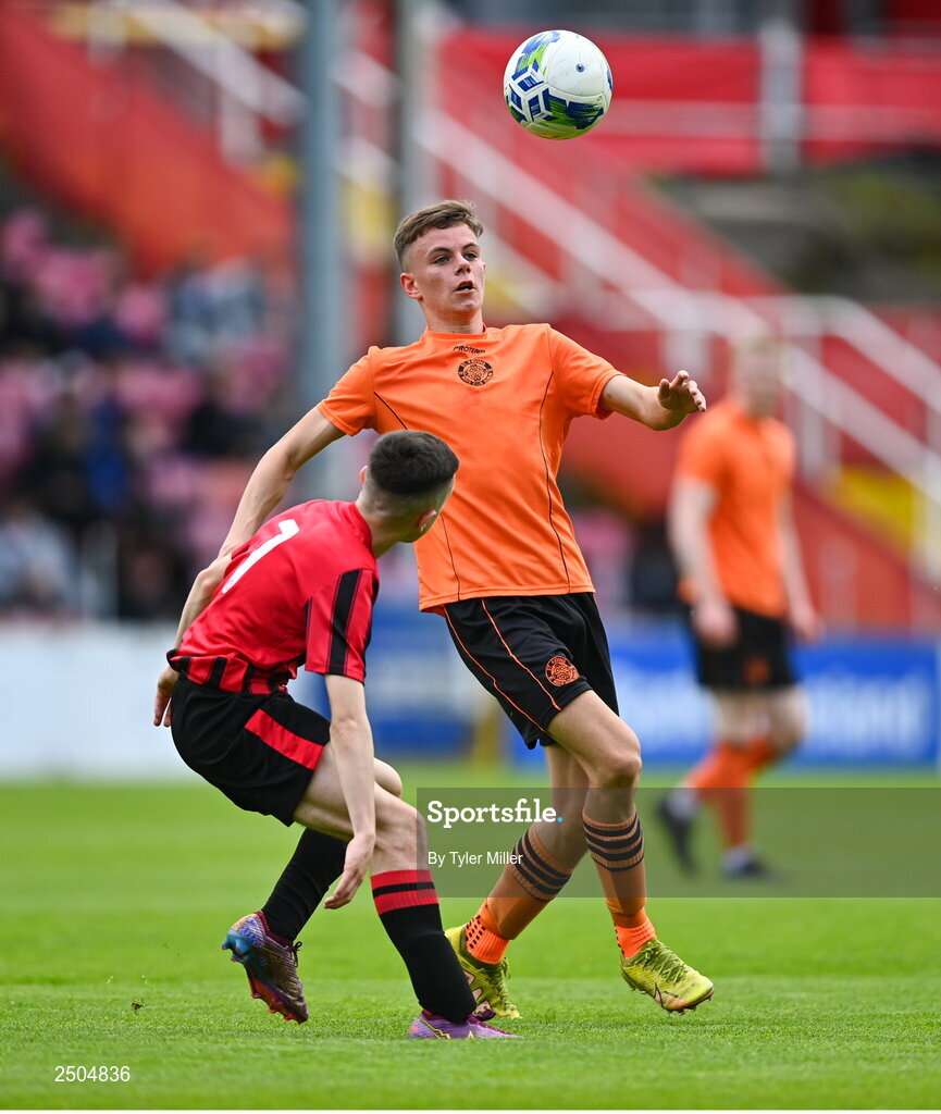 6 May 2023; Jamie Cummins of St Kevin's FC in action against Kian Matthews of Cherry Orchard FC during the FAI Under 17 Cup Final 2022/23 match between Cherry Orchard FC and St Kevin’s Boys FC at Richmond Park in Dublin. Photo by Tyler Miller/Sportsfile